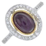 An 18ct gold ruby cabochon and brilliant-cut diamond cluster ring.Ruby calculated weight 1.27cts,