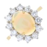 An opal cabochon and diamond cluster ring.