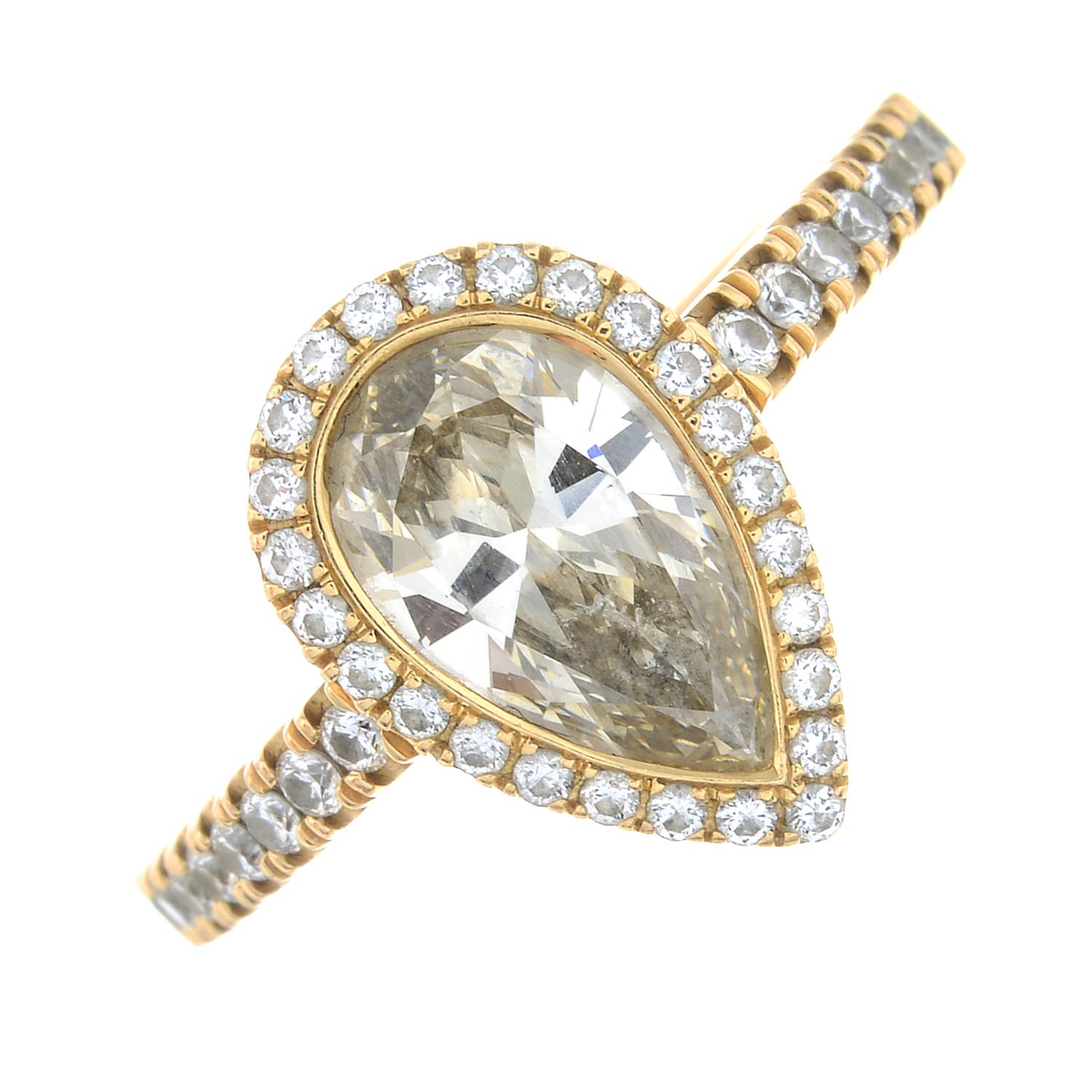 A coloured diamond and brilliant-cut diamond cluster ring.'yellowish-brown' diamond estimated