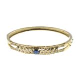 A brilliant-cut diamond and sapphire bangle,