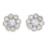 A pair of brilliant-cut diamond floral cluster earrings.Estimated total diamond weight 0.85ct,