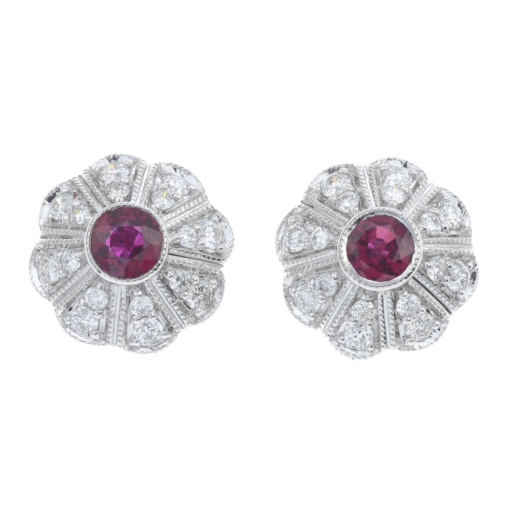 A pair of 18ct gold ruby and brilliant-cut diamond cluster earrings.Estimated total diamond weight