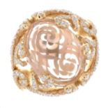 An 18ct gold morganite and brilliant-cut diamond dress ring.Morganite weight 7.76cts.Diamond weight