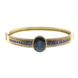 A sapphire and brilliant-cut diamond bangle.