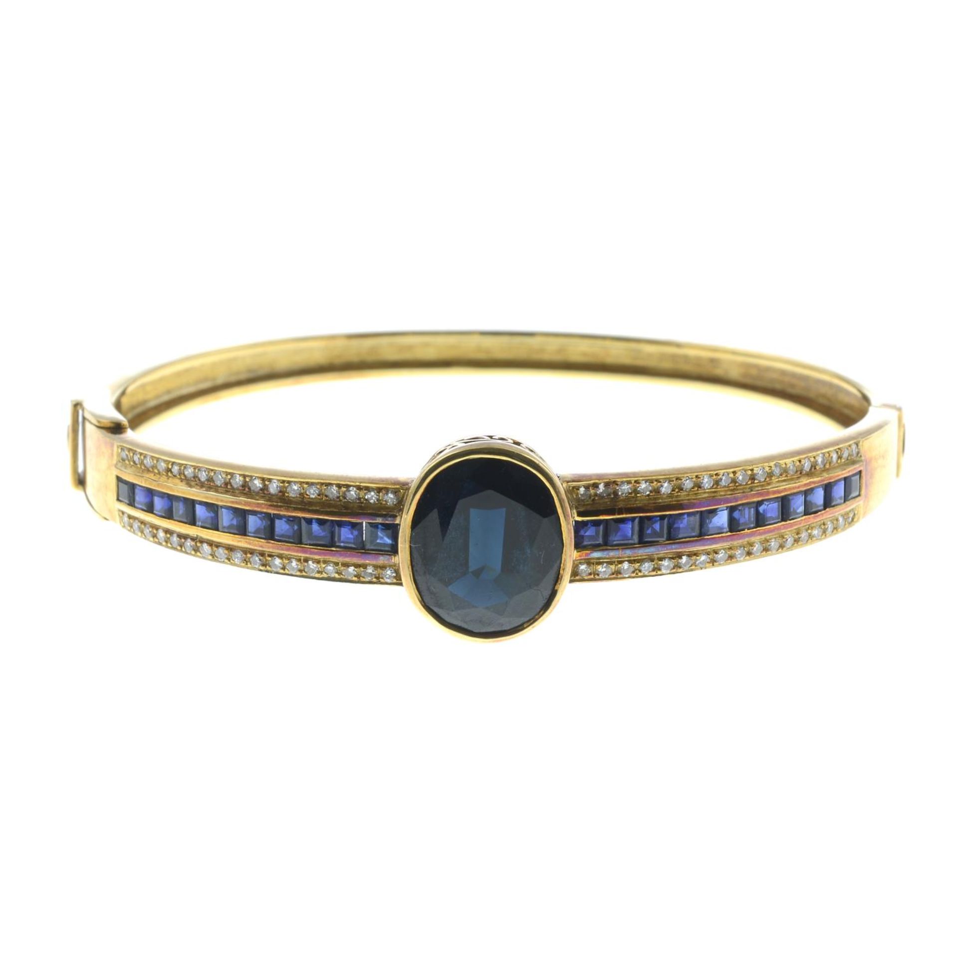 A sapphire and brilliant-cut diamond bangle.