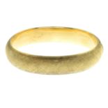 A 14ct gold textured hinged bangle.