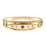An Edwardian 9ct gold garnet-topped-doublet and diamond point hinged bangle.Hallmarks for Chester,
