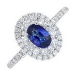 A sapphire and diamond cluster ring.