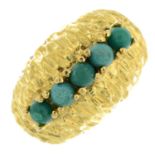 A turquoise textured dress ring.