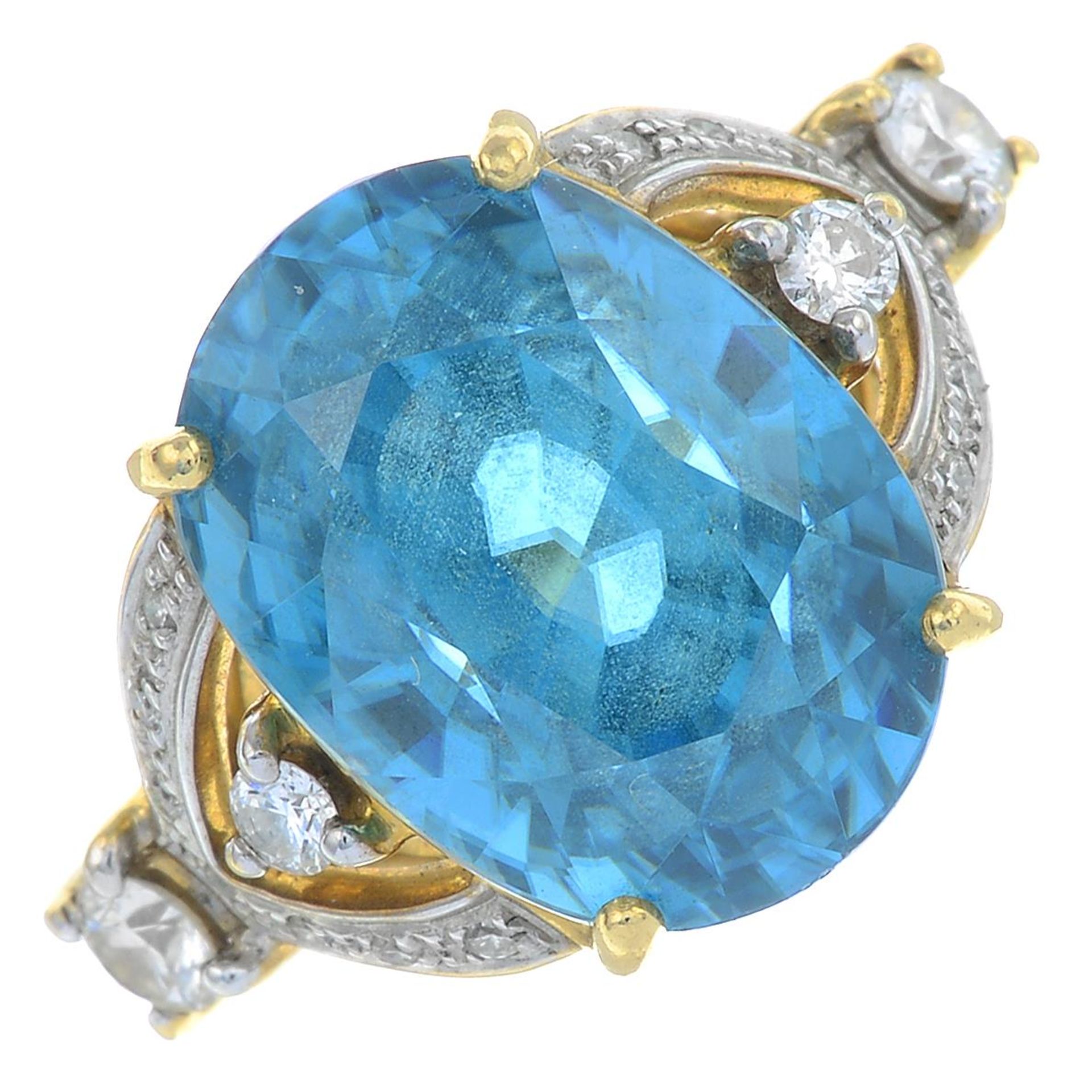 An 18ct gold blue zircon and brilliant-cut diamond dress ring.Zircon calculated weight 13.26cts,