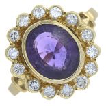 An 18ct gold amethyst and brilliant-cut diamond cluster ring.Amethyst calculated weight 2.03cts,