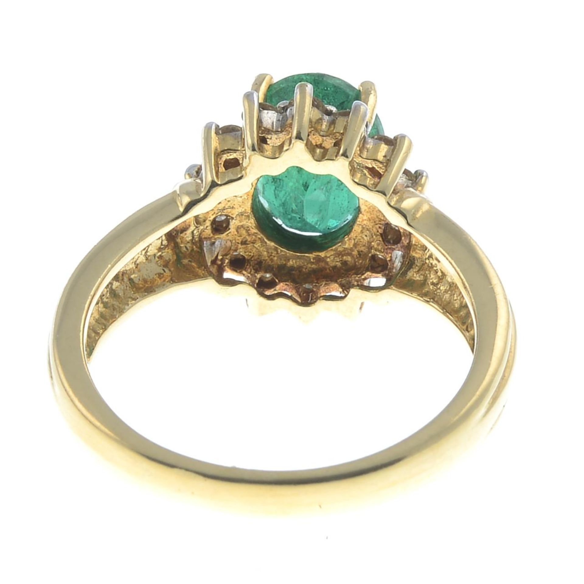 An 18ct gold emerald and brilliant-cut diamond cluster ring.Emerald calculated weight 1.81cts, - Image 2 of 3