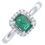 An emerald and brilliant-cut diamond cluster ring.Total diamond weight 0.13ct,