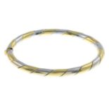 A bi-colour hinged bangle.Stamped 750.Inner diameter 5.2cms.