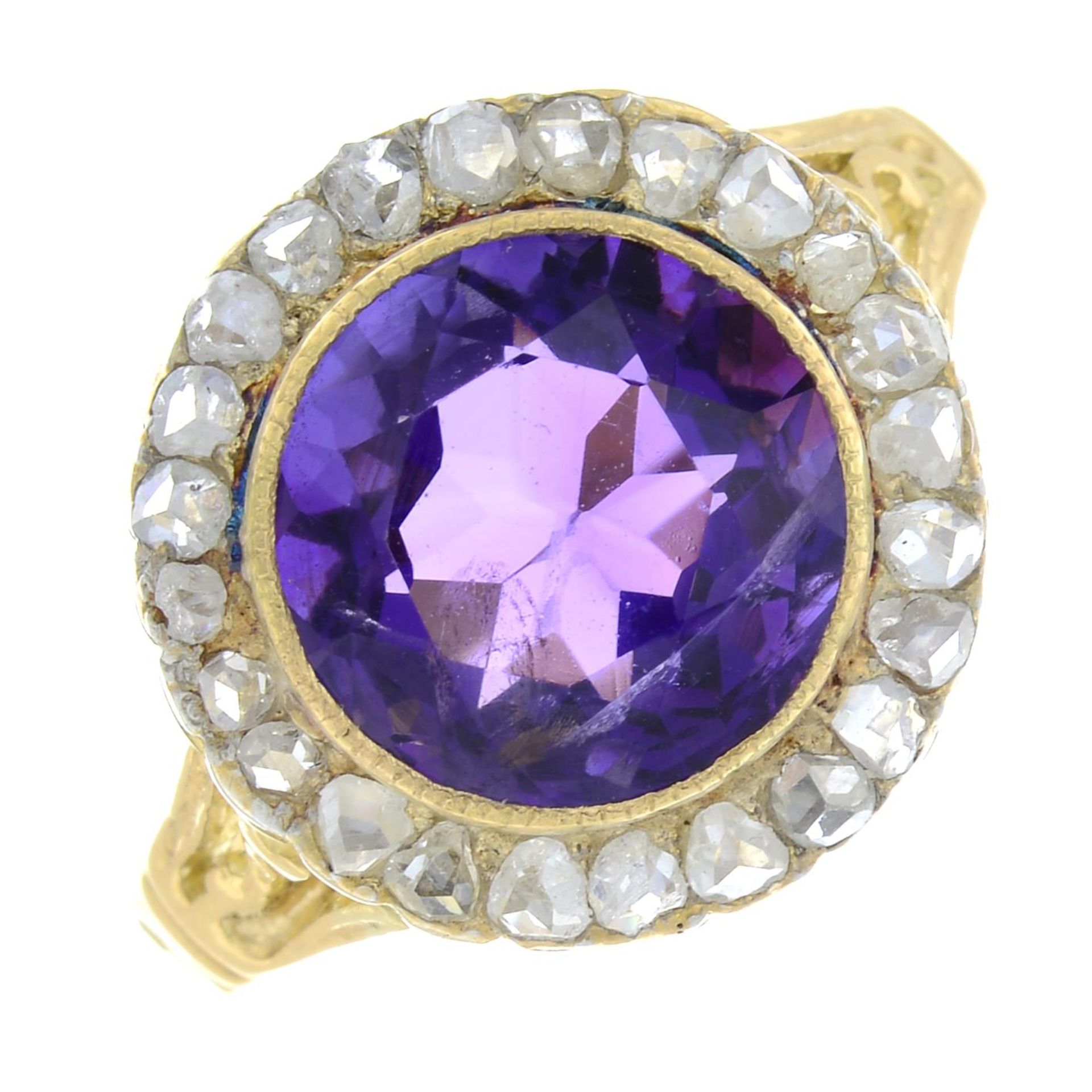 An amethyst and rose-cut diamond cluster ring.Amethyst weight 2.73cts.Ring size M.