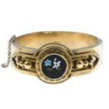 A mid 19th century gold pietra dura hinged bangle.Stamped 14K.Inner diameter 5.8cms.
