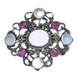 An early 20th century silver moonstone and ruby brooch.Length 3cms.