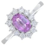 An 18ct gold pink sapphire and brilliant-cut diamond cluster ring.Sapphire weight 0.75ct.Total