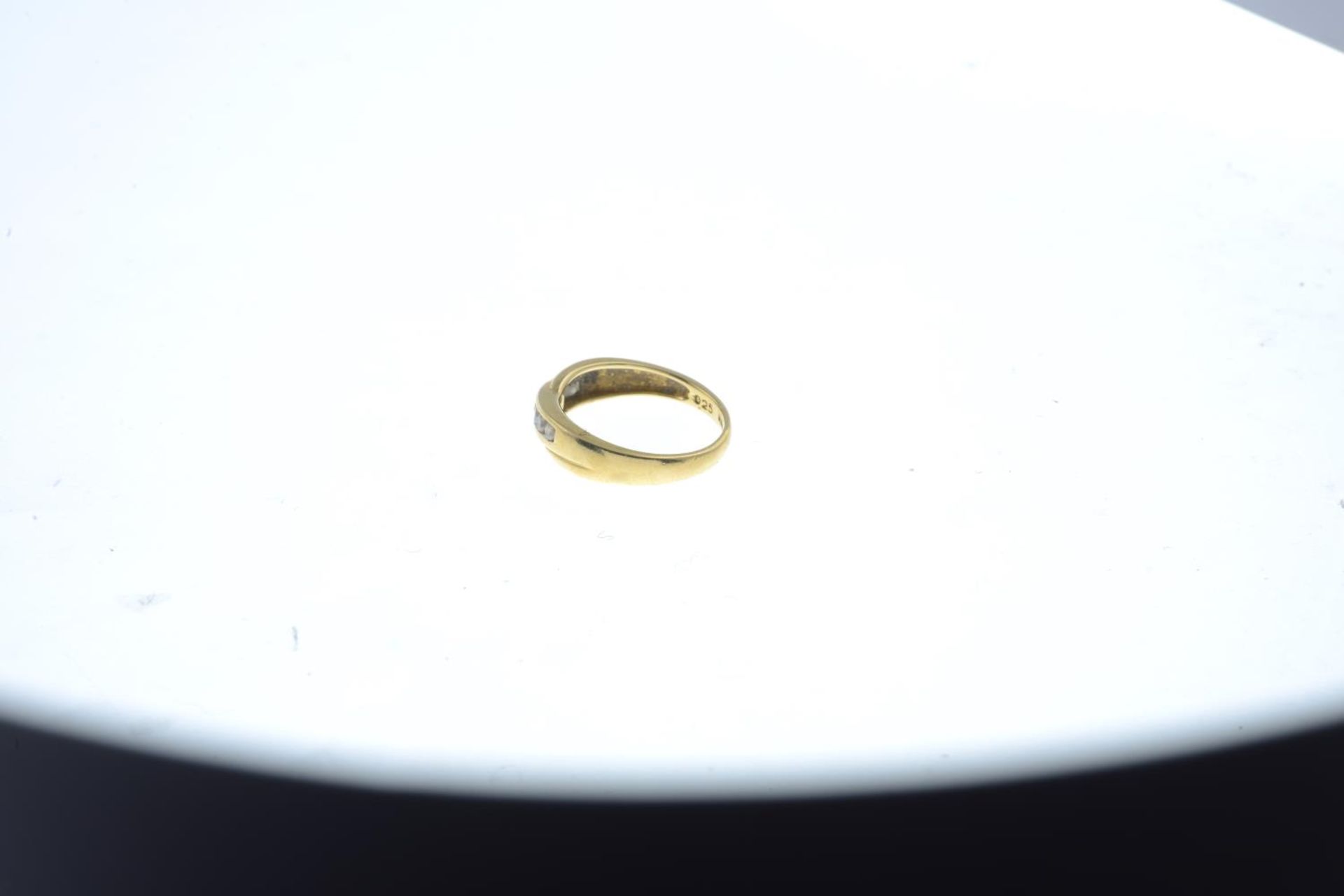 An 18ct gold brilliant-cut diamond crossover ring.Total diamond weight 0.25ct, stamped to band. - Image 3 of 3