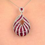 A ruby and diamond pendant.