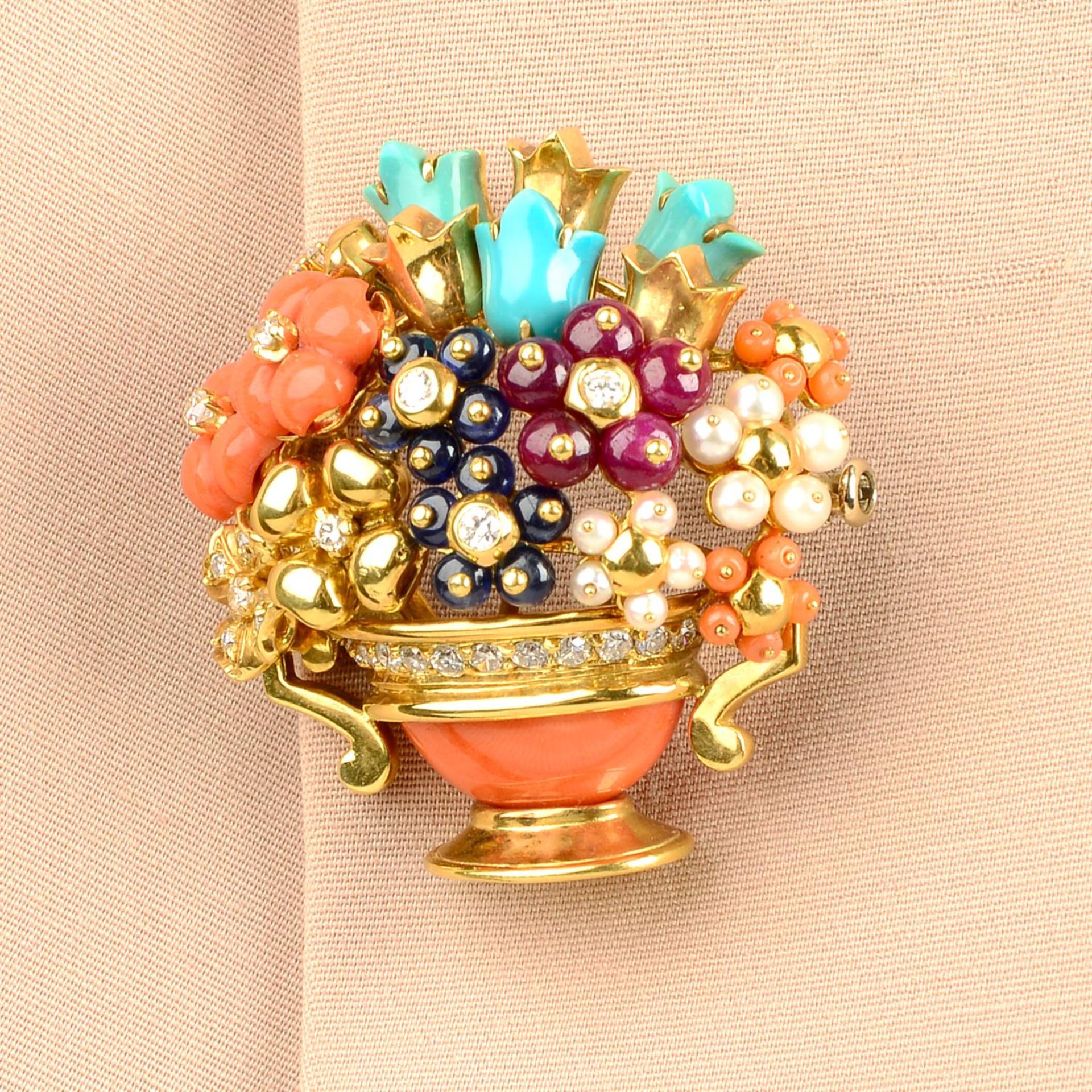 A coral, turquoise, diamond, ruby, sapphire and seed pearl floral bouquet brooch.