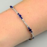 An 18ct gold sapphire and diamond line bracelet.