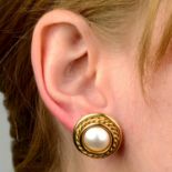A pair of mabé pearl earrings.