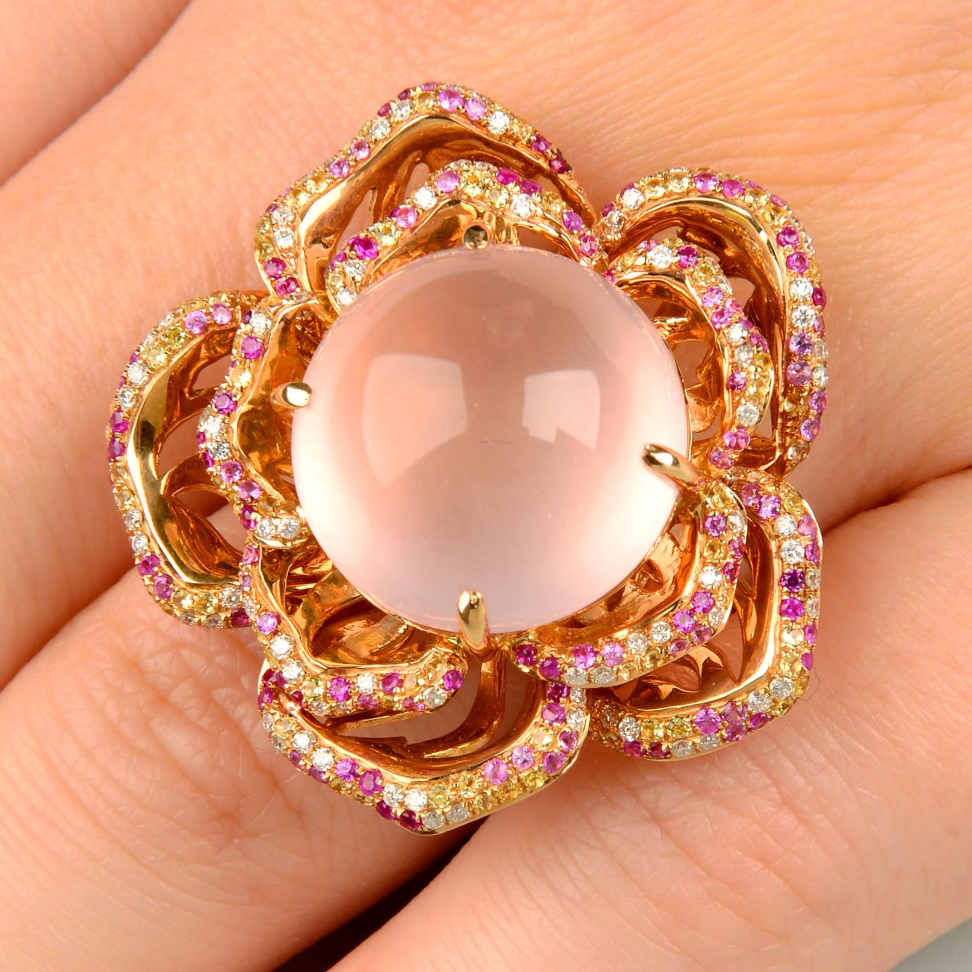 An 18ct gold rose quartz, pink and yellow sapphire and diamond floral dress ring.