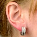 A pair of calibré-cut diamond hinged hoop earrings.Estimated total diamond weight 3cts,