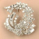 A mid 20th century brilliant and baguette-cut diamond cluster spray brooch.