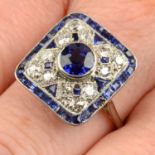 A sapphire and diamond geometric ring.Principal sapphire calculated weight 0.89ct,