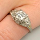 An early to mid 20th century brilliant-cut diamond single-stone ring, with diamond shoulders.