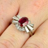 A platinum ruby and vari-cut diamond cluster ring.