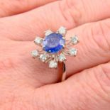 A mid 20th century sapphire and brilliant-cut diamond cluster ring.Sapphire calculated weight