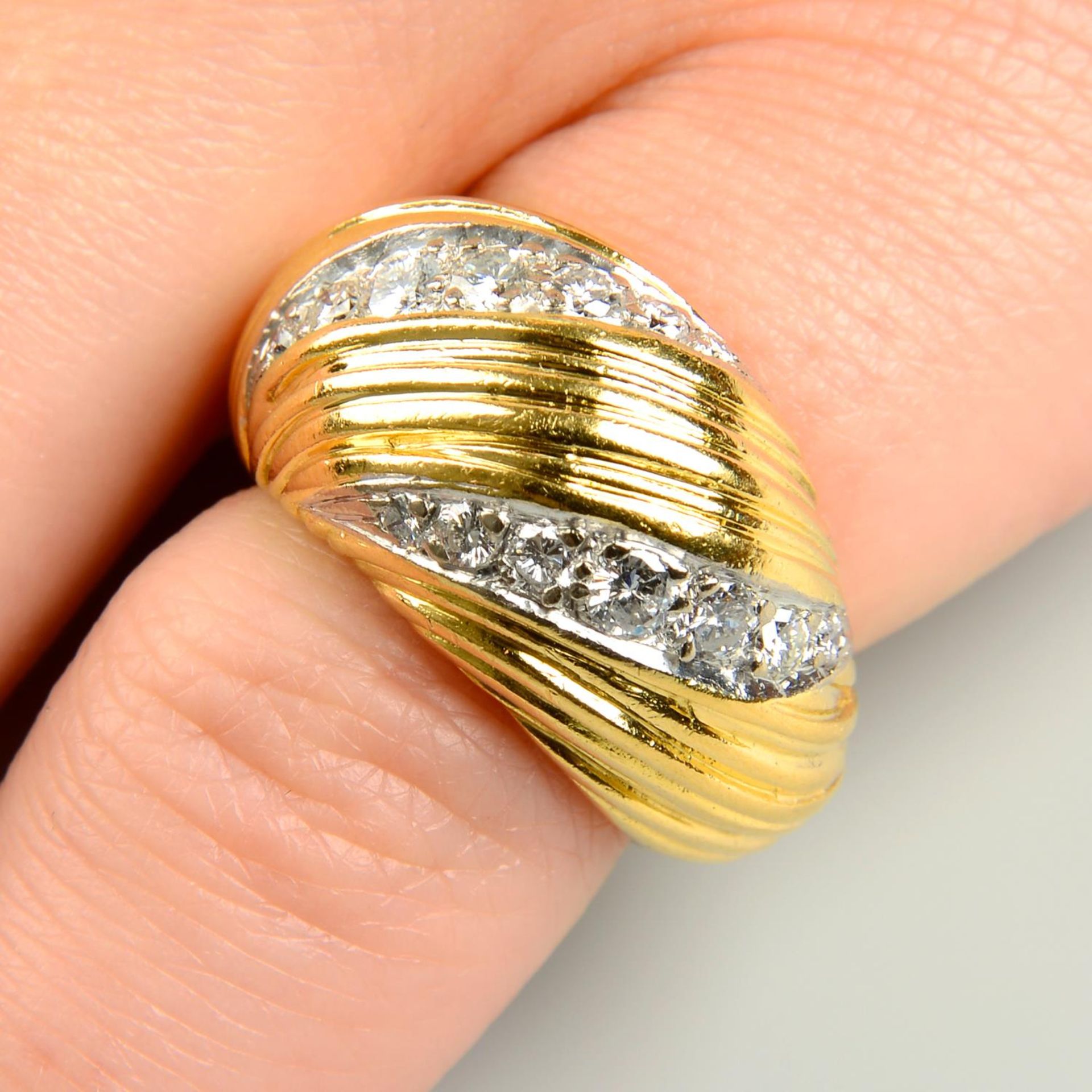 A 1970s 18ct gold brilliant-cut diamond grooved and tapered bombe ring,