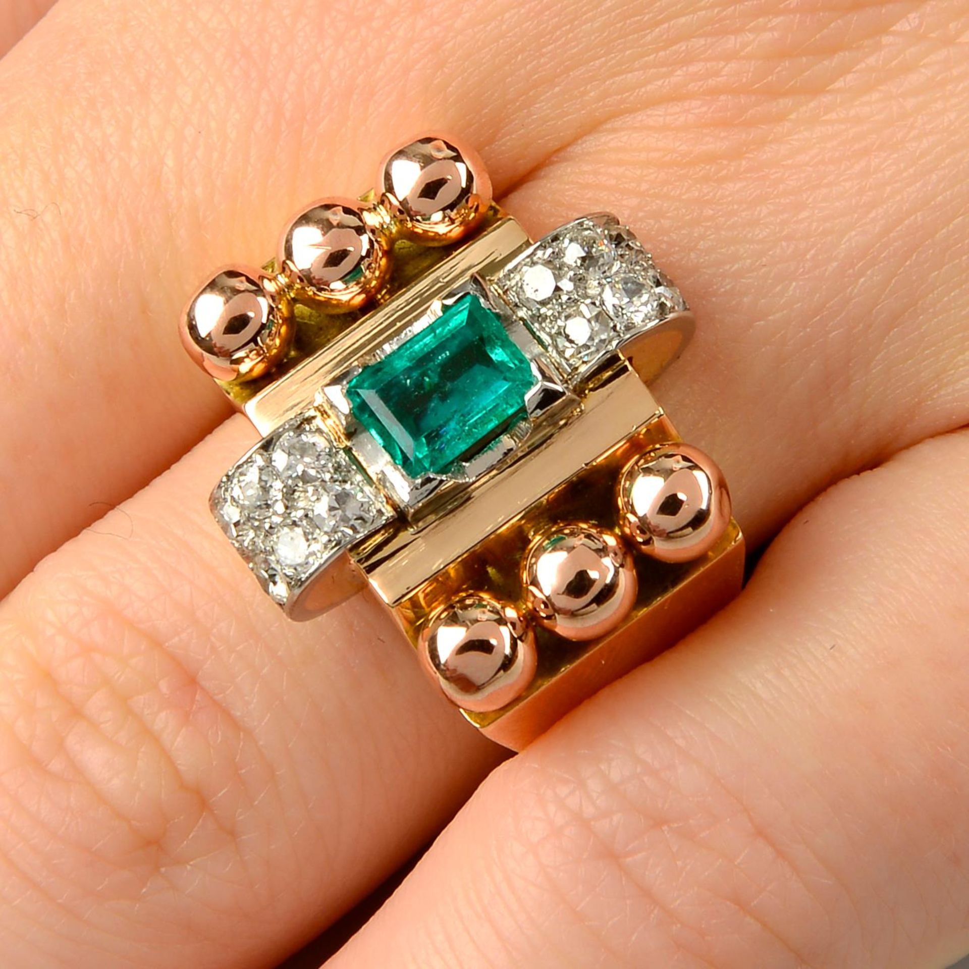 A 1940s 18ct gold and platinum, emerald and diamond dress ring.