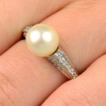 A pearl single-stone ring, with pavé-set diamond shoulders.