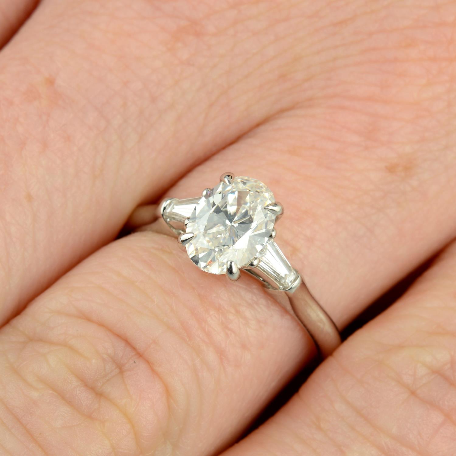 A platinum oval-shape diamond single-stone ring,