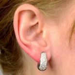 A pair of pavé-set diamond hoop earrings.