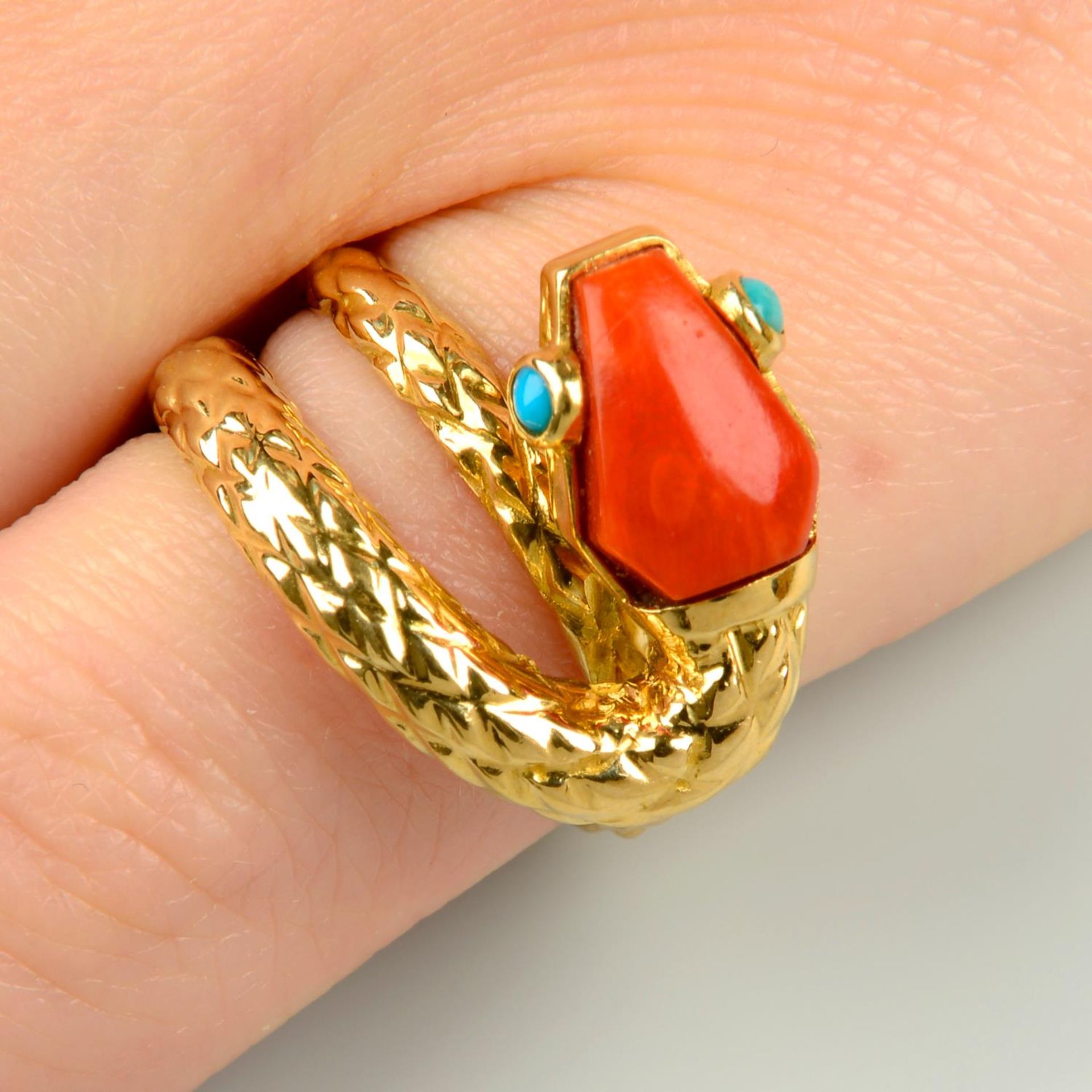 A mid 20th century coral and turquoise snake ring, by Cartier.Stamped 750.