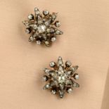 A pair of late 19th century silver and gold old-cut diamond star brooches.Estimated total diamond