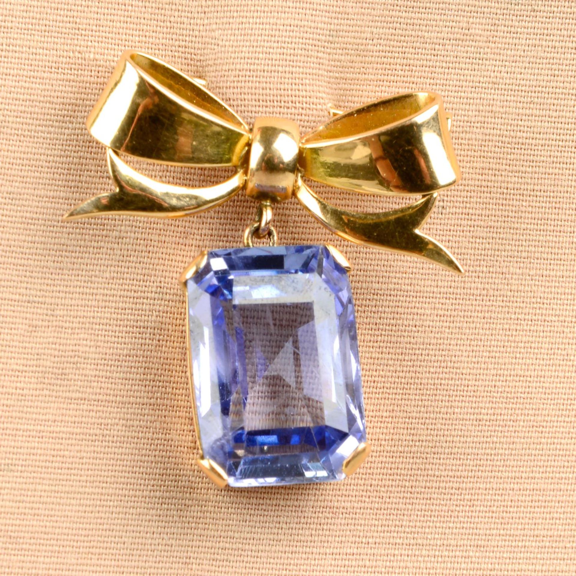 A mid 20th century 18ct gold Sri Lankan sapphire bow brooch.