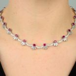 A platinum, ruby and tapered baguette-cut diamond necklace,