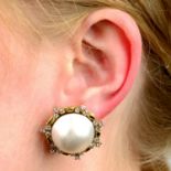 A pair of mabé pearl and diamond earrings.