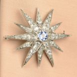 A sapphire and diamond star brooch.