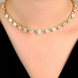 An impressive 18ct gold brilliant-cut diamond rivière necklace.Principal diamonds each with reports