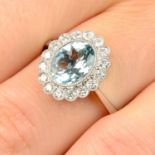 An 18ct gold aquamarine and diamond cluster ring.