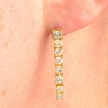 A pair of brilliant-cut diamond drop earrings.