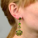 A pair of peridot and ruby floral drop earrings.