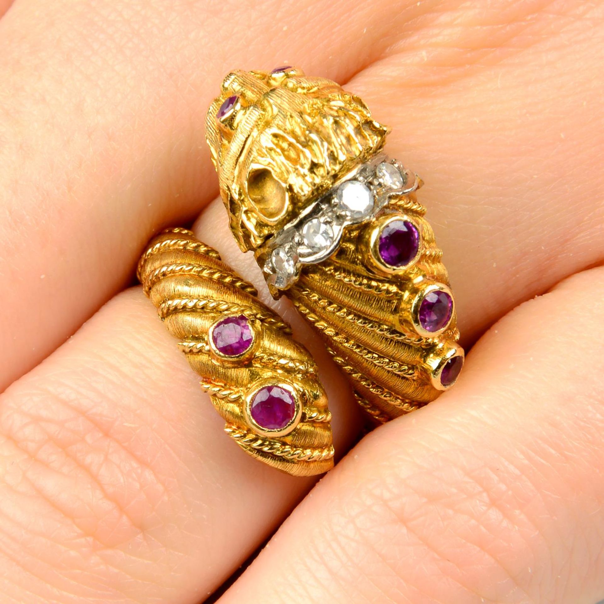 A ruby and diamond lion head dress ring, by Ilias Lalaounis.